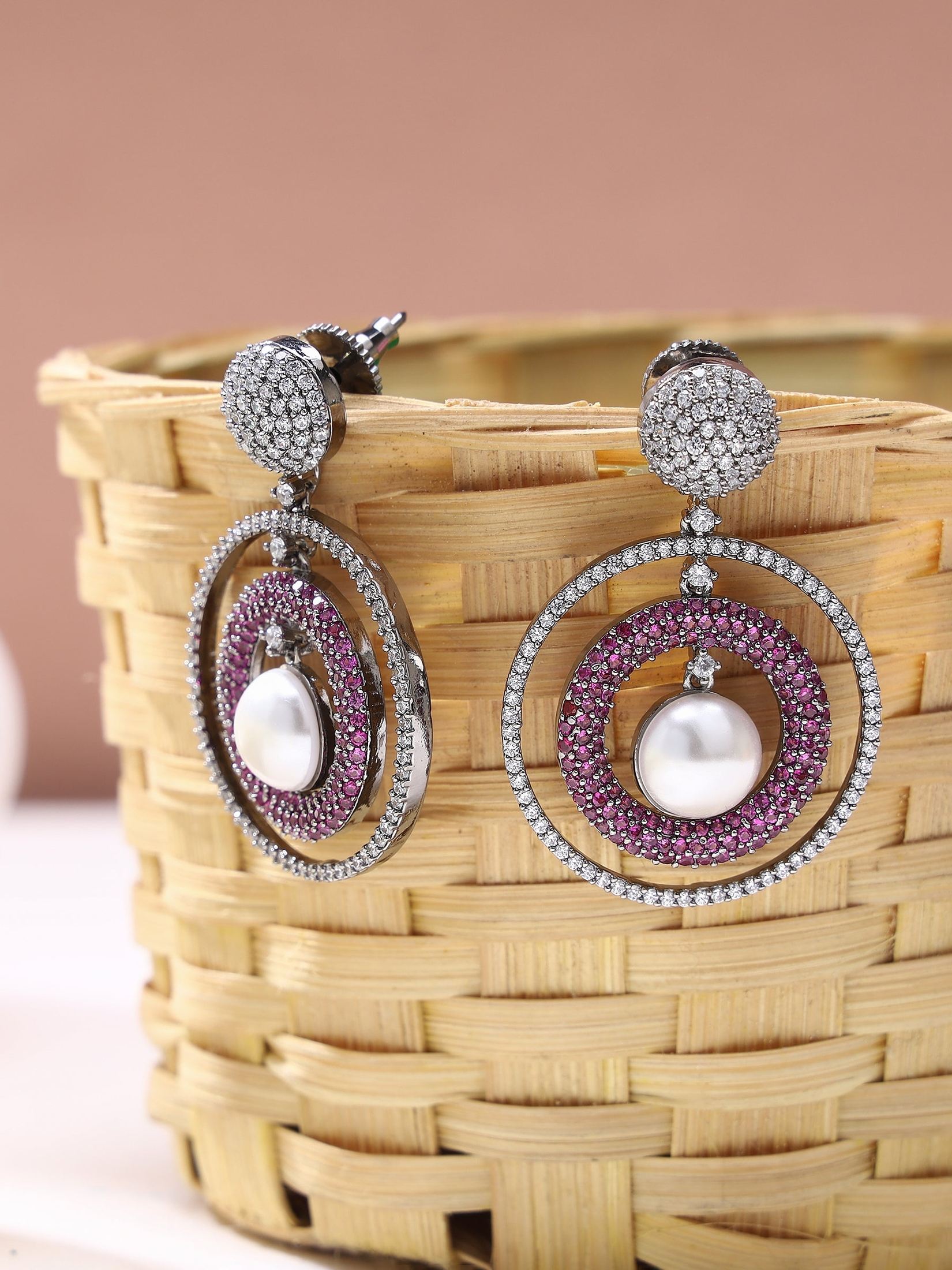 Concentric pearl and american diamond studded earring